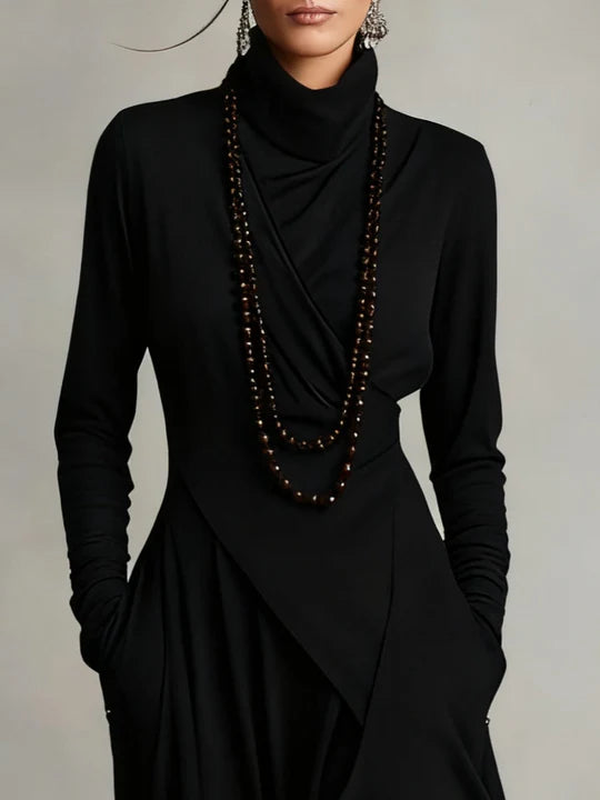 AURELIA | VESTIDO LARGO PLISADO ASIMÉTRICO CON CUELLO ALTO